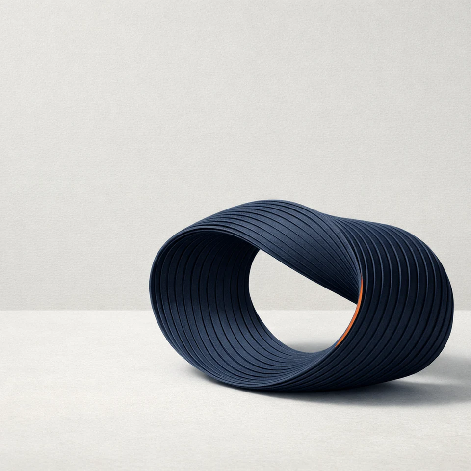 Layered blue paper sculpture on a pale surface